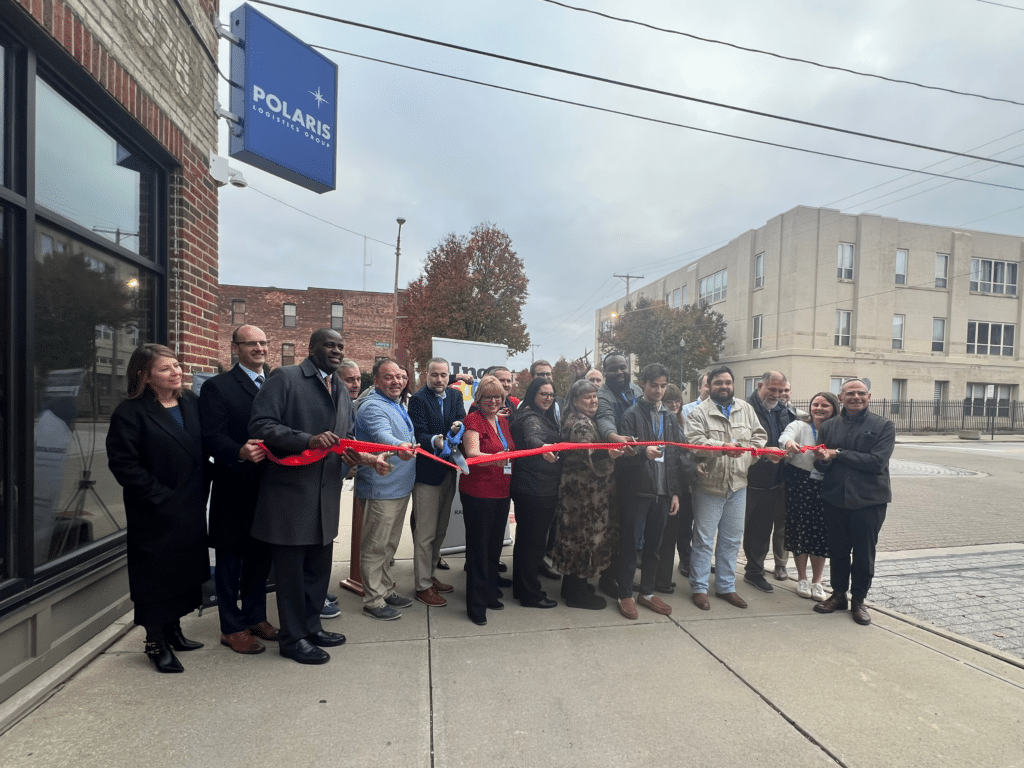 Polaris Employees cutting ceremonial ribbon outside new headquarters